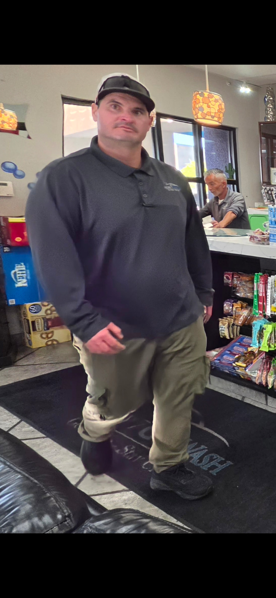 Jason, General Manager of Lucky 7 Hand Car Wash in Henderson, at the front counter