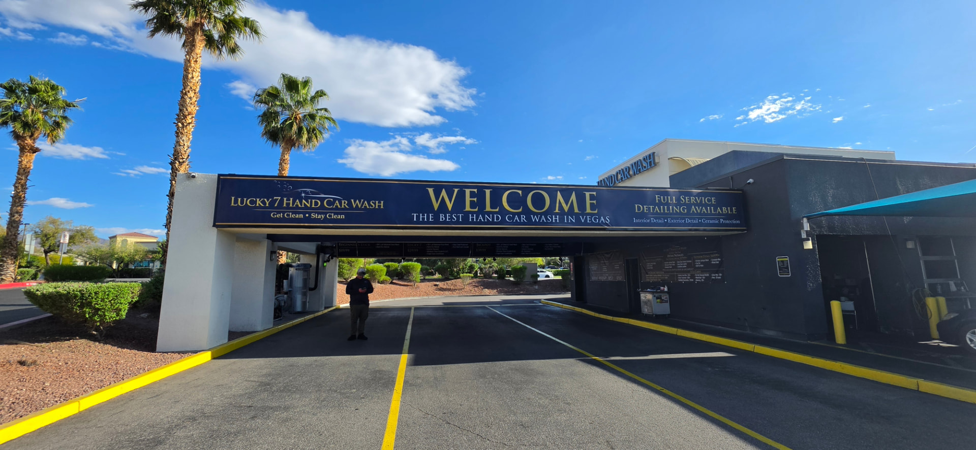 Lucky 7 Hand Car Wash welcome arch and wash lanes in Henderson, Nevada